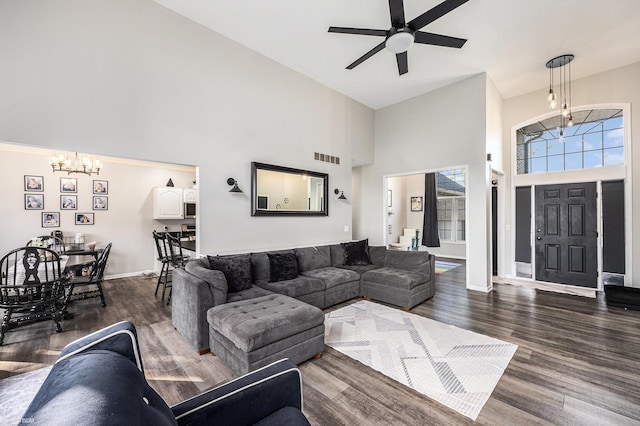 53564 Grace Dr, New Baltimore, MI 48047 - living room with a chandelier, high vaulted ceiling, dark wood-style floors, and a ceiling fan