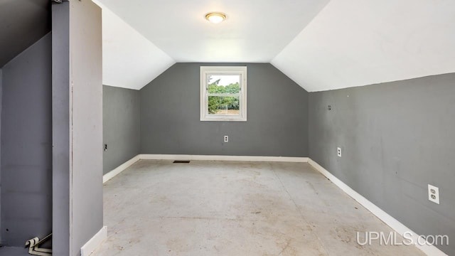 N1953 M67 Hwy, Limestone, MI 49816 - additional living space featuring vaulted ceiling and unfinished concrete flooring