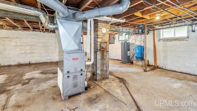 N1953 M67 Hwy, Limestone, MI 49816 - below grade area with water heater, a water pressure tank, and heating unit