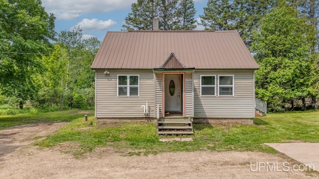 N1953 M67 Hwy, Limestone, MI 49816 - view of front facade featuring a metal roof and a front lawn