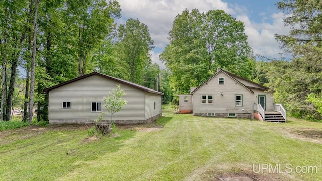 N1953 M67 Hwy, Limestone, MI 49816 - rear view of house with a yard