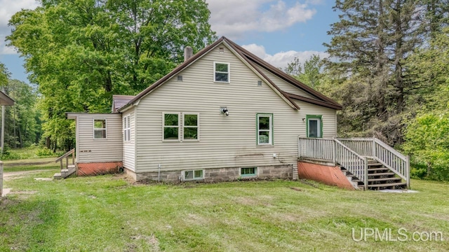 N1953 M67 Hwy, Limestone, MI 49816 - rear view of house featuring a yard and stairs