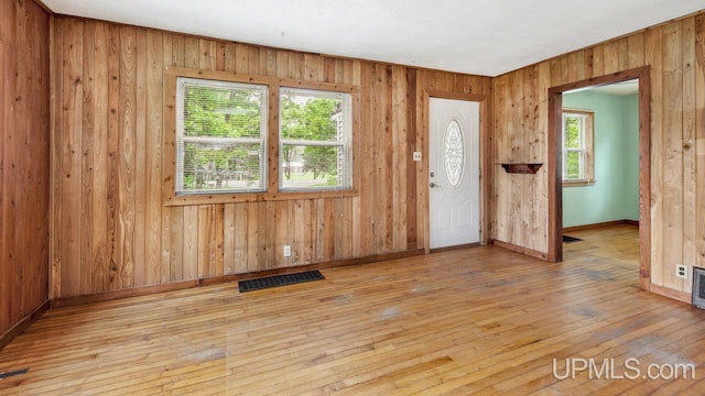 N1953 M67 Hwy, Limestone, MI 49816 - foyer featuring healthy amount of natural light, wood-type flooring, and wooden walls