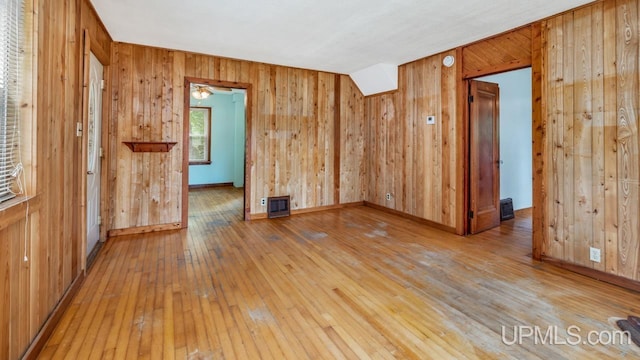 N1953 M67 Hwy, Limestone, MI 49816 - unfurnished room with light wood finished floors and wood walls