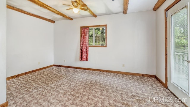 N1953 M67 Hwy, Limestone, MI 49816 - unfurnished room featuring beam ceiling, carpet flooring, and a ceiling fan