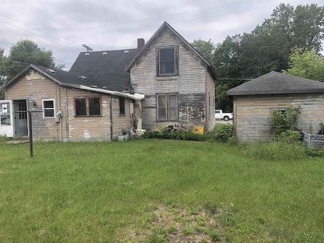 152 N Corning St, Farwell, MI 48622 - rear view of house with a yard