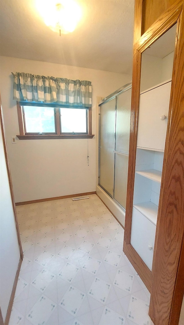 9470 Arbela Rd, Millington, MI 48746 - full bathroom with tile patterned floors and a stall shower