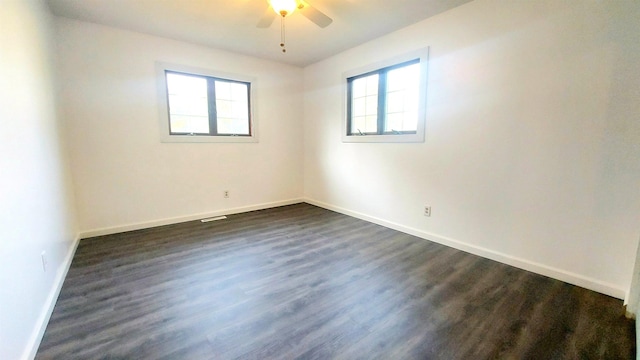 9470 Arbela Rd, Millington, MI 48746 - unfurnished room featuring a ceiling fan and dark wood-style flooring