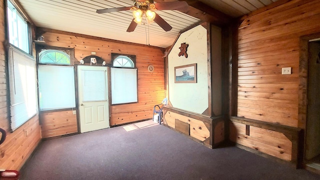 9470 Arbela Rd, Millington, MI 48746 - carpeted spare room with wooden walls, vaulted ceiling, a ceiling fan, and wood ceiling