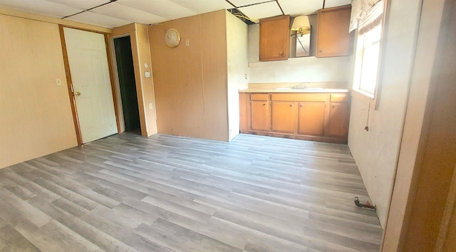 9470 Arbela Rd, Millington, MI 48746 - kitchen featuring light wood-style flooring, light countertops, and a paneled ceiling