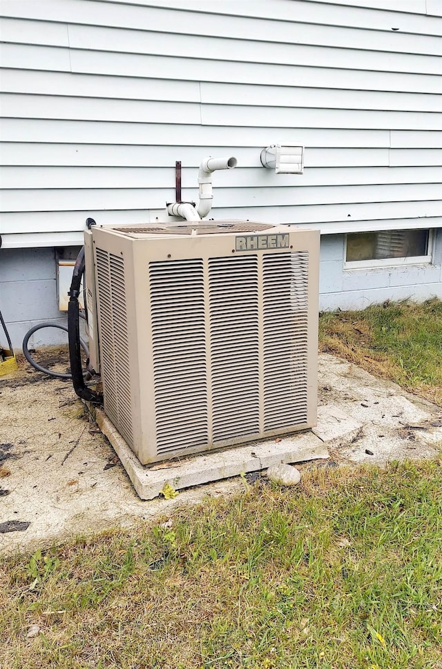9470 Arbela Rd, Millington, MI 48746 - exterior view of a central air condition unit and crawl space