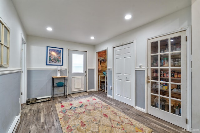 15951 Water St, Garden, MI 49835 - foyer with wood finished floors, recessed lighting, and a baseboard radiator