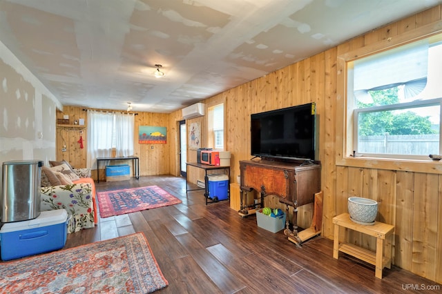 15951 Water St, Garden, MI 49835 - living area with a wall mounted air conditioner, wood walls, and wood finished floors