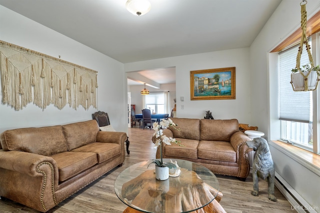 15951 Water St, Garden, MI 49835 - living room featuring light wood-type flooring and a baseboard heating unit