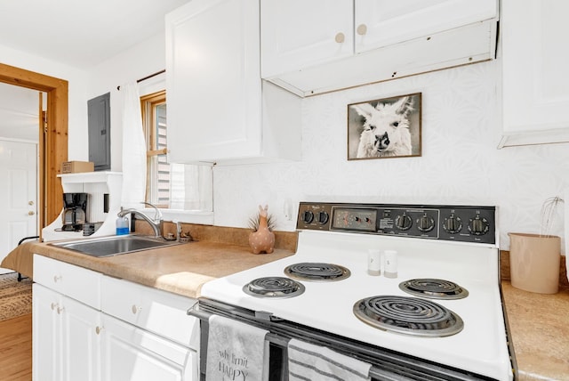 7416 Forest Rd, Lexington, MI 48450 - kitchen featuring white electric stove, white cabinetry, light countertops, and electric panel