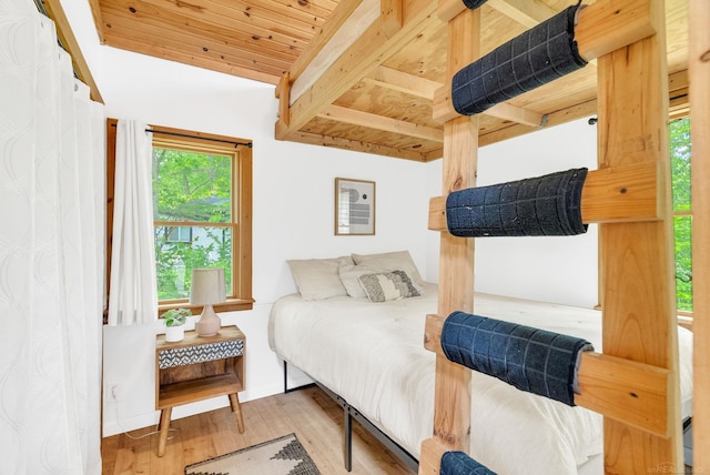 7416 Forest Rd, Lexington, MI 48450 - bedroom featuring a wood ceiling with exposed beams and wood finished floors