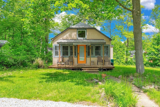 7416 Forest Rd, Lexington, MI 48450 - view of front of property featuring a shingled roof and a porch