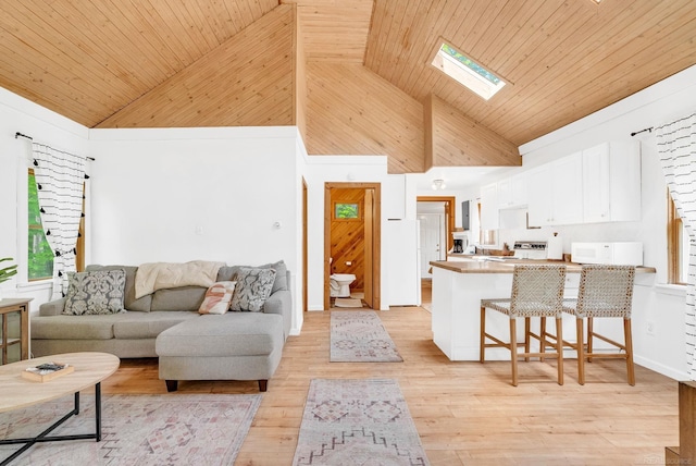 7416 Forest Rd, Lexington, MI 48450 - living room with high vaulted ceiling, wooden ceiling, light wood-type flooring, and a skylight