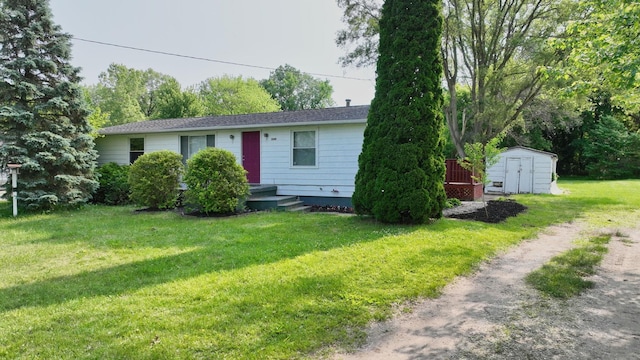 13148 Saginaw Rd, Clio, MI 48420 - ranch-style house with a storage shed and a front yard