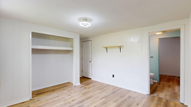 13148 Saginaw Rd, Clio, MI 48420 - unfurnished bedroom with wood finished floors and a closet