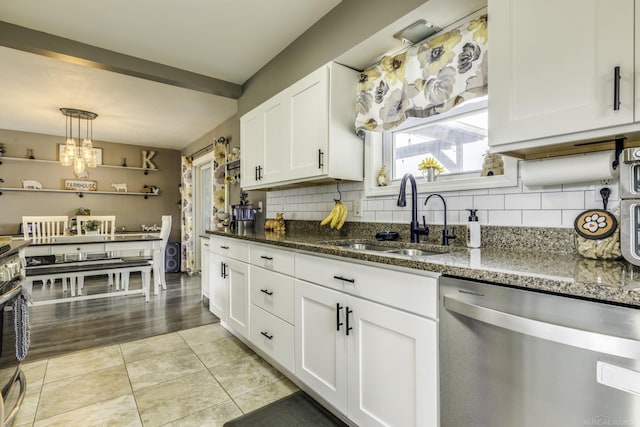 4856 Wagner Rd, Croswell, MI 48422 - kitchen featuring dishwasher, white cabinetry, decorative backsplash, and dark stone countertops