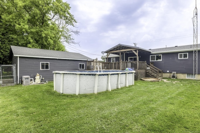 4856 Wagner Rd, Croswell, MI 48422 - back of house featuring a deck and an outdoor pool