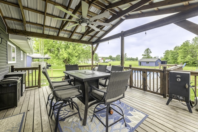 4856 Wagner Rd, Croswell, MI 48422 - wooden terrace featuring ceiling fan, outdoor dining space, and a yard