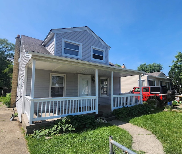 11444 Cadillac St, Warren, MI 48089 - bungalow-style home featuring a porch and a chimney