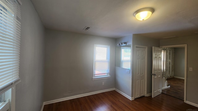 11444 Cadillac St, Warren, MI 48089 - unfurnished bedroom with dark wood-type flooring and a closet