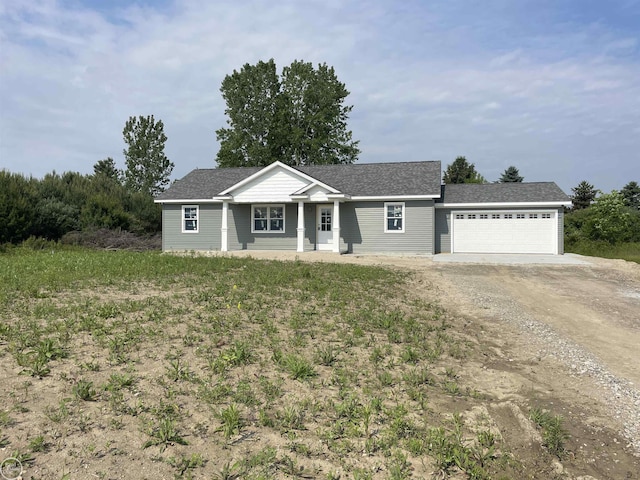 8540 Wildcat Rd, Jeddo, MI 48032 - single story home with driveway, a garage, and a shingled roof