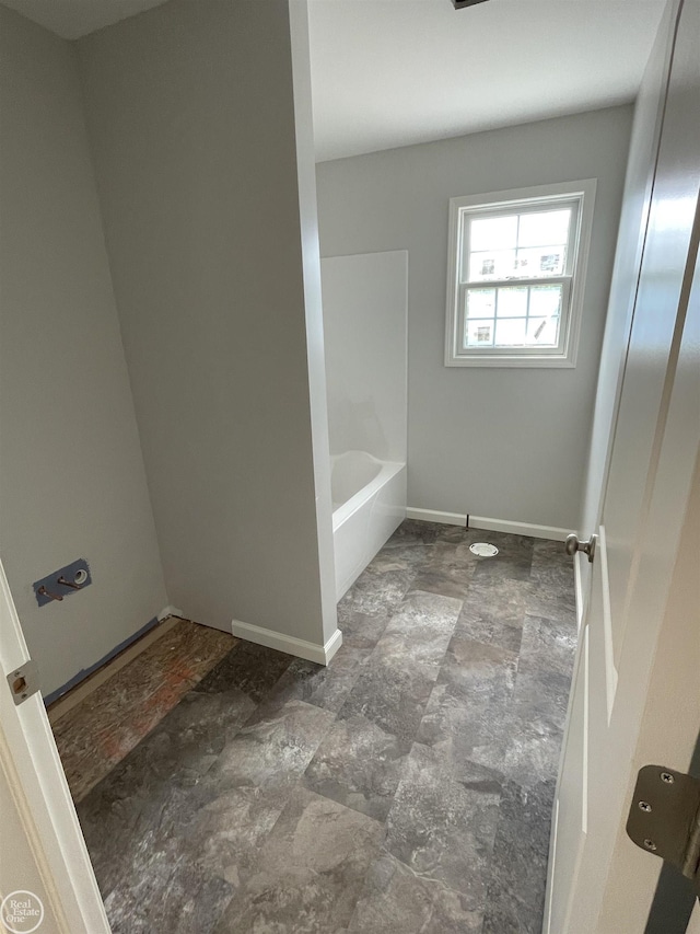 8540 Wildcat Rd, Jeddo, MI 48032 - bathroom with a bathtub, stone finish flooring, and a shower