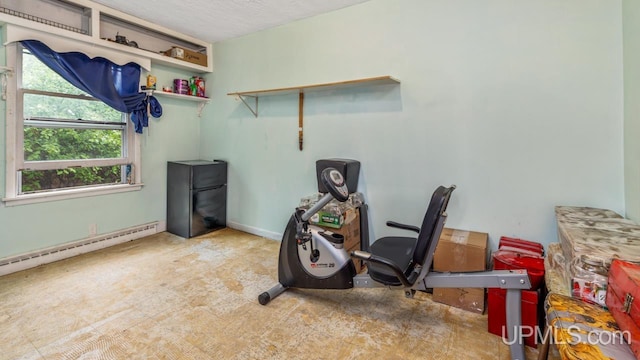 939 N 20th St, Escanaba, MI 49829 - misc room featuring a baseboard radiator, a textured ceiling, and carpet