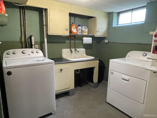 301 N 7th Ave, Hurley, WI 54534 - laundry area featuring cabinet space, separate washer and dryer, and concrete block wall