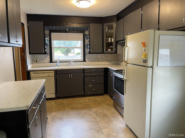 301 N 7th Ave, Hurley, WI 54534 - kitchen with white appliances, light countertops, and glass insert cabinets
