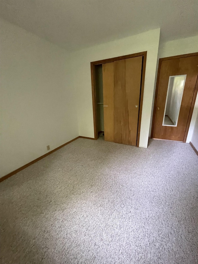 1549 N 7 Mile Rd, Sanford, MI 48657 - unfurnished bedroom with a closet and light carpet