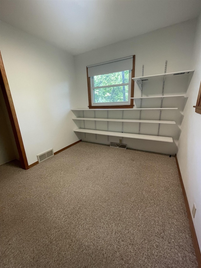 1549 N 7 Mile Rd, Sanford, MI 48657 - empty room with carpet floors and baseboards