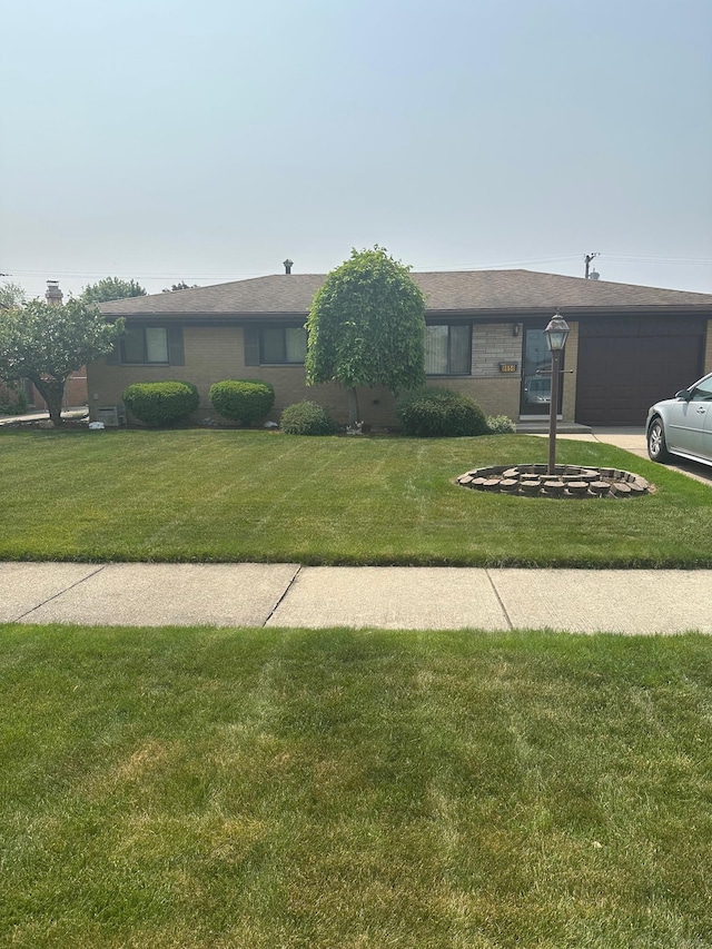 8856 Balboa Ave, Sterling Heights, MI 48313 - single story home with a front lawn and a garage