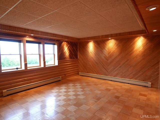 1120 Dextrom Rd, Calumet, MI 49913 - spare room featuring a baseboard radiator, wooden walls, and recessed lighting