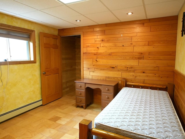 1120 Dextrom Rd, Calumet, MI 49913 - bedroom featuring baseboard heating, light flooring, wooden walls, a paneled ceiling, and recessed lighting