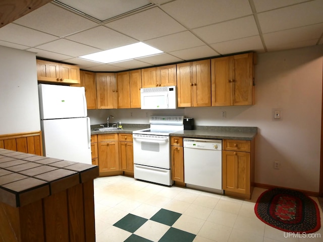 1120 Dextrom Rd, Calumet, MI 49913 - kitchen featuring white appliances, a paneled ceiling, and light flooring
