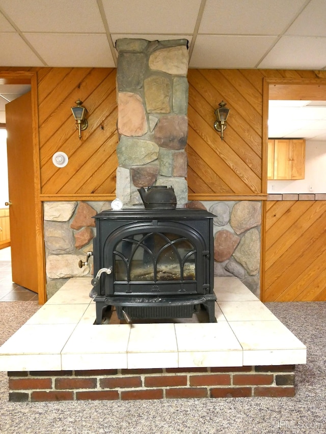1120 Dextrom Rd, Calumet, MI 49913 - detailed view of a wood stove, a drop ceiling, and wood walls