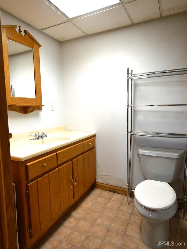 1120 Dextrom Rd, Calumet, MI 49913 - bathroom with vanity, a drop ceiling, and tile patterned floors