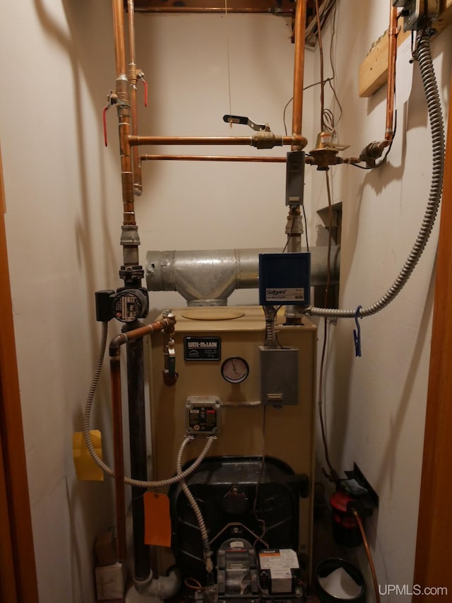 1120 Dextrom Rd, Calumet, MI 49913 - utility room with a heating unit