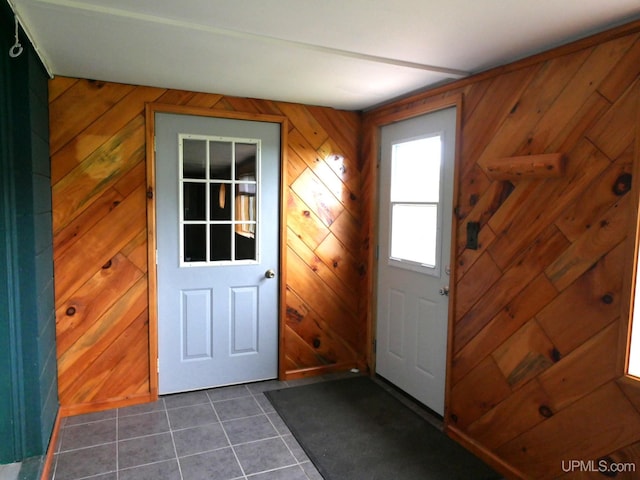 1120 Dextrom Rd, Calumet, MI 49913 - doorway to outside with dark tile patterned flooring and wooden walls