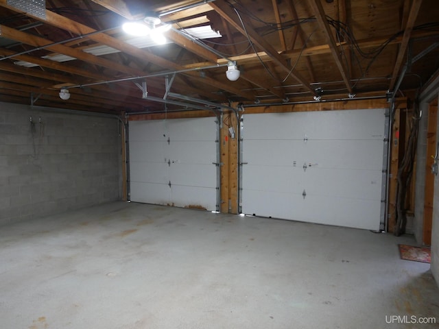 1120 Dextrom Rd, Calumet, MI 49913 - garage featuring concrete block wall