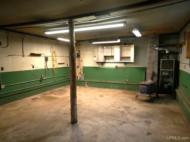 1120 Dextrom Rd, Calumet, MI 49913 - basement with a wood stove