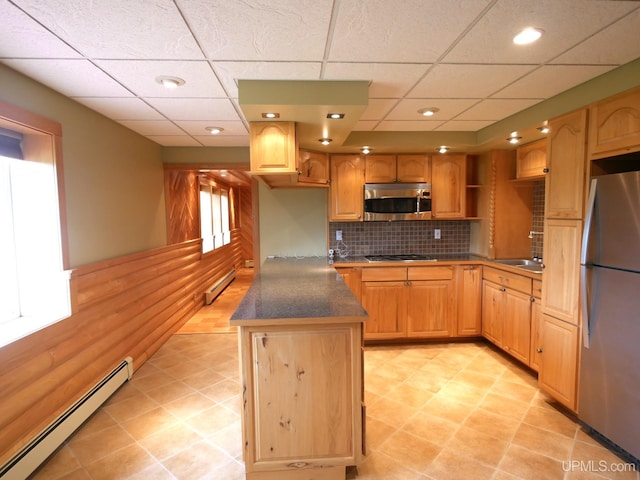 1120 Dextrom Rd, Calumet, MI 49913 - kitchen with stainless steel appliances, a baseboard radiator, tasteful backsplash, dark countertops, and a drop ceiling