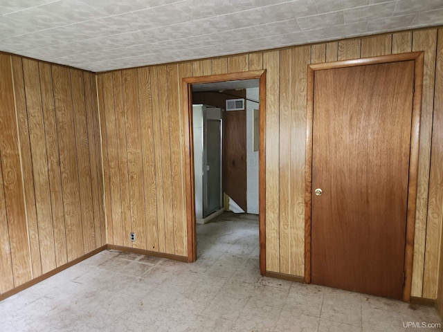 1120 Dextrom Rd, Calumet, MI 49913 - empty room featuring wood walls and light flooring