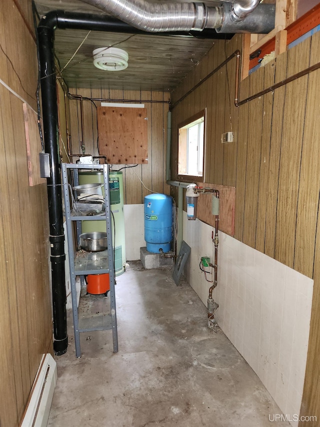 1120 Dextrom Rd, Calumet, MI 49913 - below grade area featuring a water pressure tank and a baseboard radiator