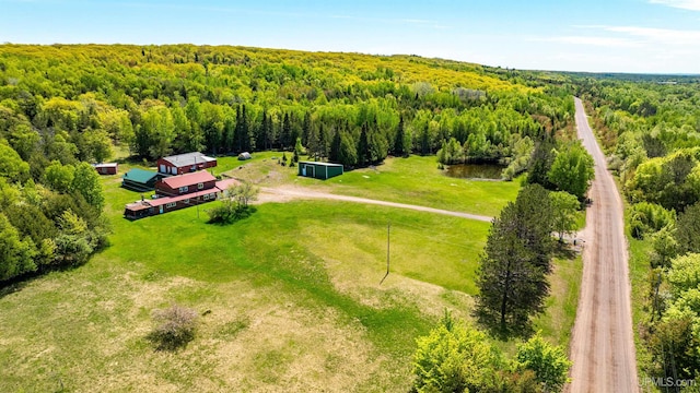 1120 Dextrom Rd, Calumet, MI 49913 - aerial view of property and surrounding area featuring a heavily wooded area